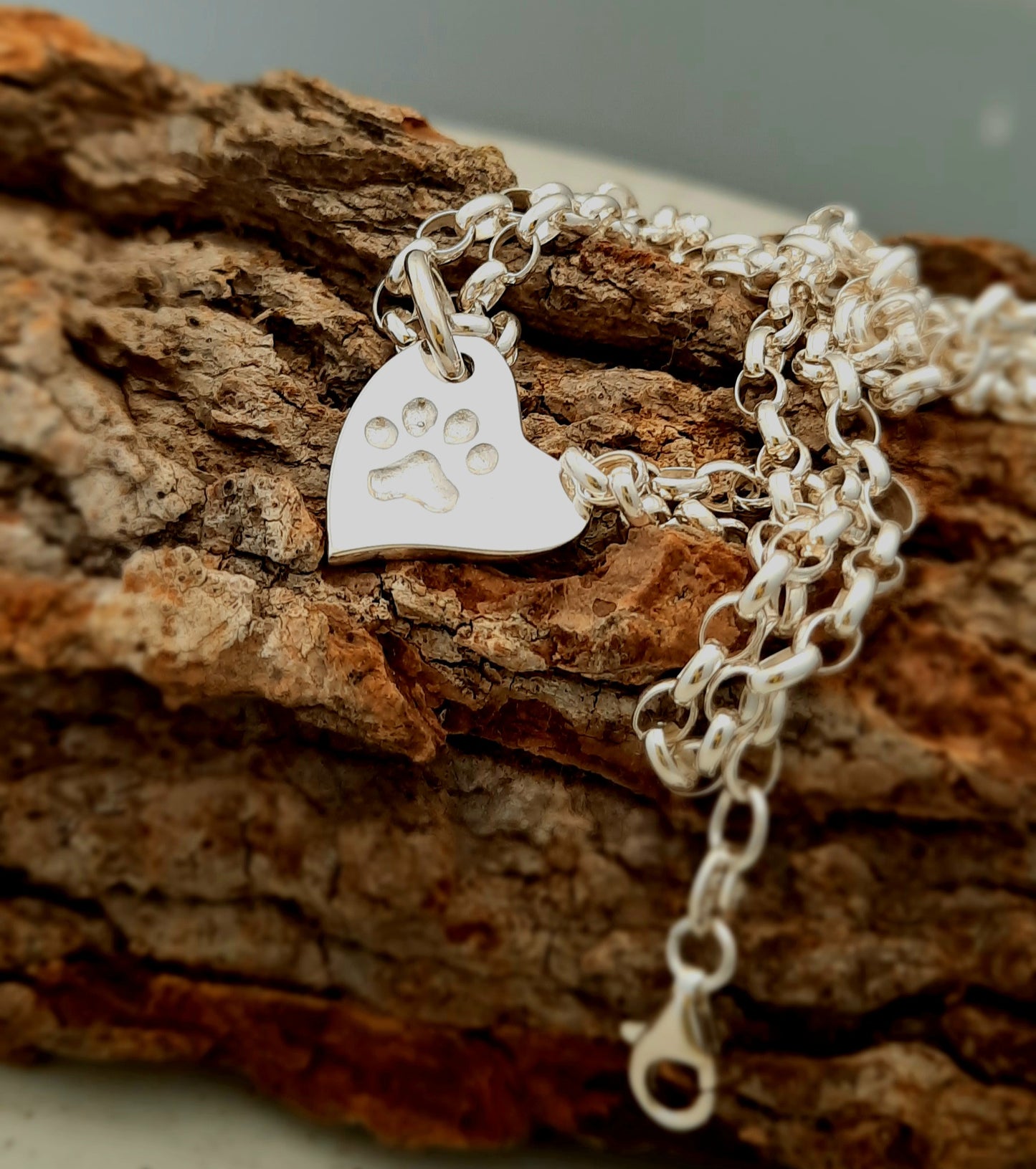 Heart shaped pendant with paw print